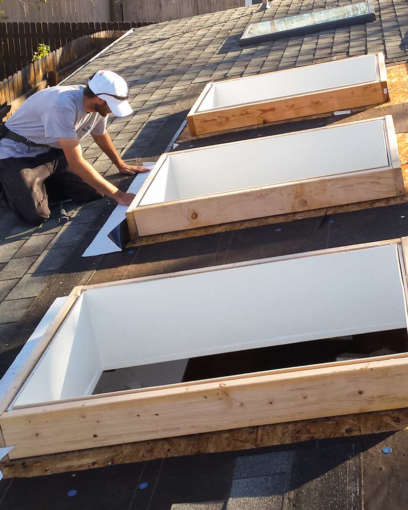 technician working on a skylight installation.