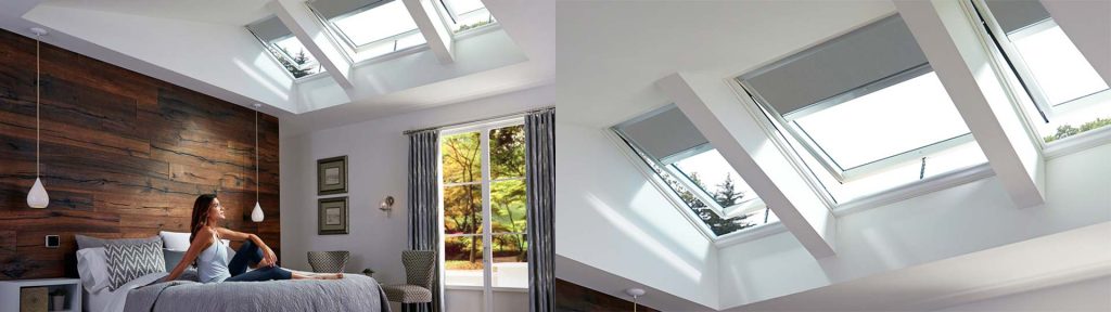 A woman sitting on her bed and basking in the sunlight from her skylights.