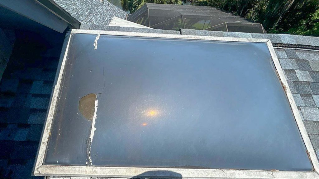View of the cracked skylight on the roof.