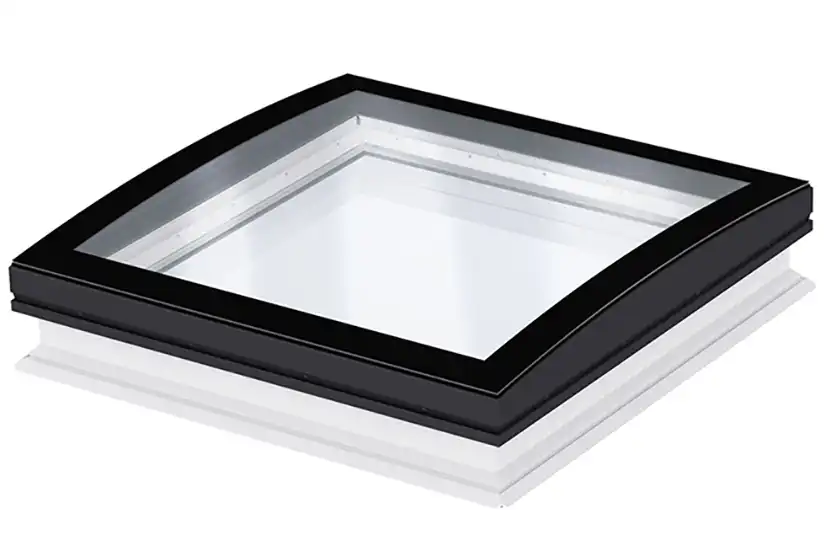 A square skylight with curved glass and a black frame, designed by Velux for flat roofs.