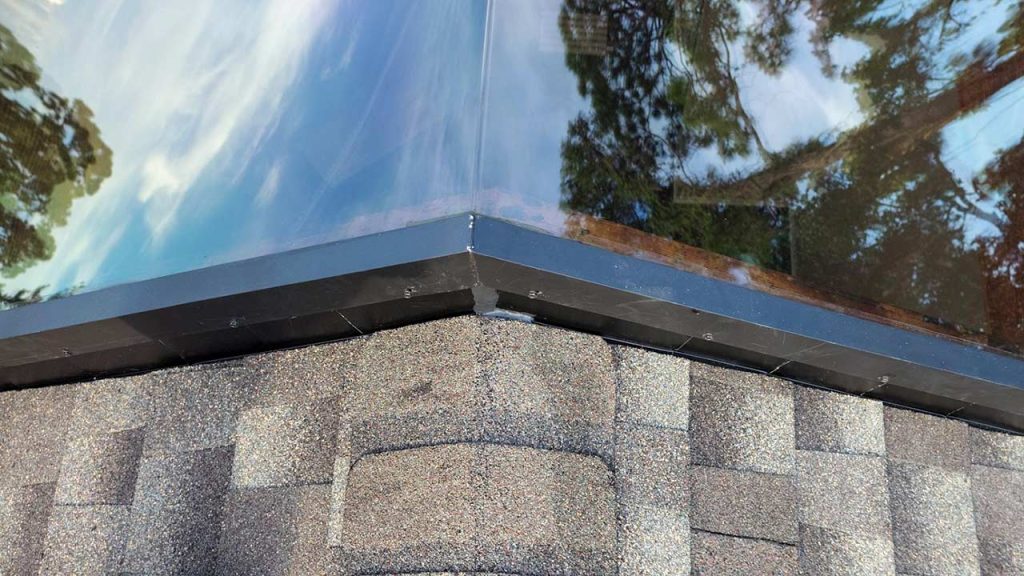 Installed American Skylights custom ridge-mount skylight on a residential roof in Florida.