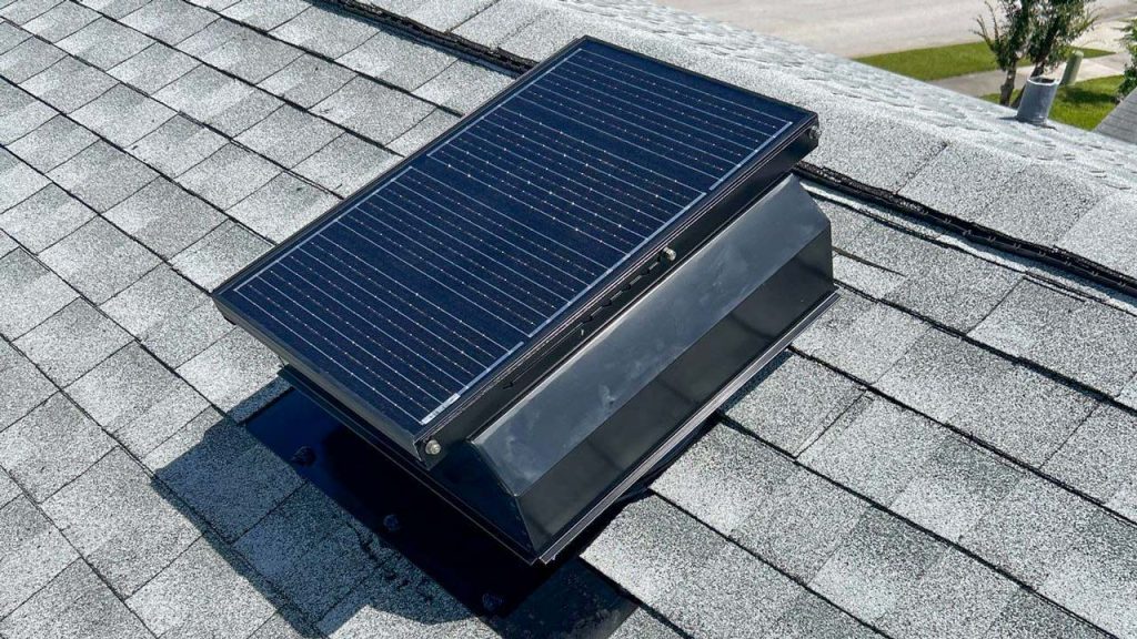 Attic Breeze solar attic vent model SFA with integrated solar panel installed on an asphalt shingle roof