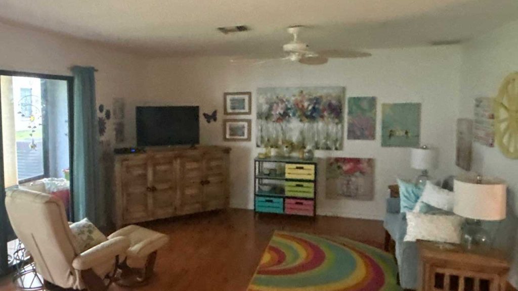 Interior ceiling view of a residential living room showing natural daylight illumination provided by an installed VELUX TMR 010 Sun Tunnel.
